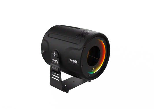A black cylindrical DJ Power Smoke Ring Machine with a handle. The front displays a vibrant RGB LED light ring encircling the grill, and DJ Power branding is visible on the side. The machine rests on a bracket stand.
