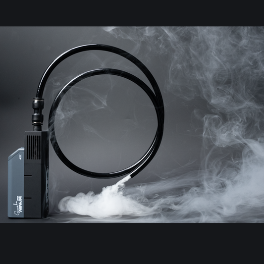 The PMI SmokeNINJA Special Effect Tubing Kit emits swirling smoke through coiled black tubing against a dark background, creating a mysterious atmosphere.