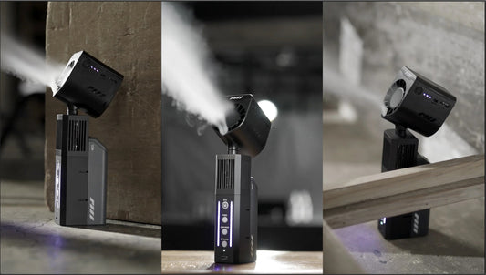 Three views of the PMI SmokeNINJA Pro Hazer Kit (Haze, Smoke & Low Fog), a compact black unit with LED indicators and vents, shown on wood and concrete in an industrial setting—perfect for photography or video production.