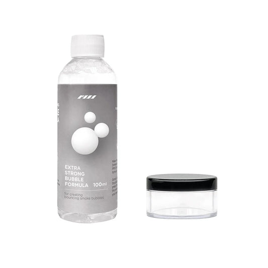 A clear bottle labeled SmokeNINJA Bubble Solution 100ml by PMI stands beside a small round black-lidded container—ideal for bubble fans seeking vivid effects or smoke-filled bubbles on a white background.