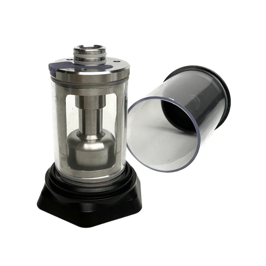 A stainless steel and clear plastic PMI SmokeNINJA/GENIE Rep Shockproof Chamber stands upright beside a removable transparent cylindrical cover, both on a white background, reflecting the clean PMI design.