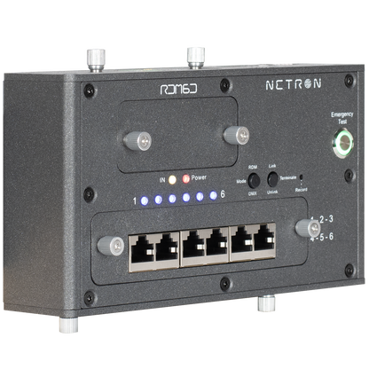 A black Obsidian NETRON RDM6D network device from Obsidian Control Systems, featuring six Ethernet ports, LED status indicators, labeled buttons, and a green emergency test light on the front panel. This DMX-compatible unit provides reliable RDM support, making it an excellent choice for professional lighting control networks using NETRON devices.