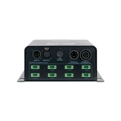 The Magmatic Prisma Driver 8 is a black electronic controller from Magmatic featuring multiple clearly labeled input and output ports, including DMX-512 control IN/OUT, fuse, power connectors, and six green terminal blocks along the bottom edge. Compact in design, this Prisma Mini UV driver operates at 48VDC to ensure reliable performance in professional lighting applications.