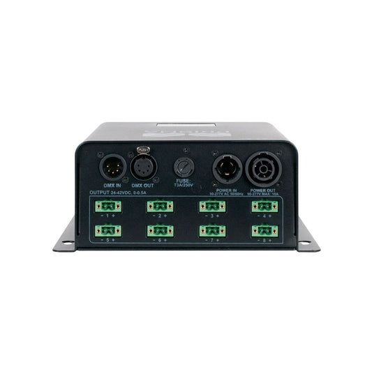 The Magmatic Prisma Driver 8 is a black electronic controller from Magmatic featuring multiple clearly labeled input and output ports, including DMX-512 control IN/OUT, fuse, power connectors, and six green terminal blocks along the bottom edge. Compact in design, this Prisma Mini UV driver operates at 48VDC to ensure reliable performance in professional lighting applications.