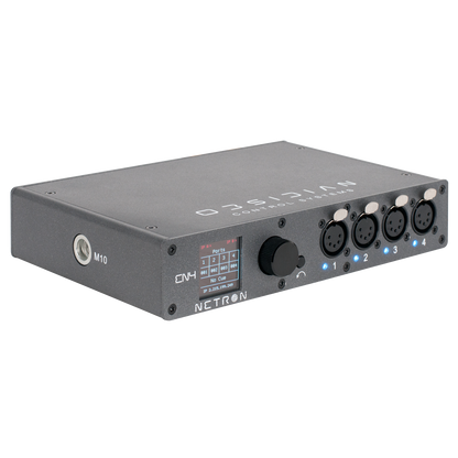 The Obsidian NETRON EN4 from Obsidian Control Systems is a gray, box-shaped DMX interface device featuring four XLR ports, a display screen, control knob, and labeled buttons. Serving as a four-universe node and Ethernet-to-DMX gateway with RDM compatibility, it is shown angled against a plain white background.