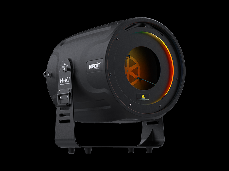 A black cylindrical spotlight labeled DJ Power, identified as the DJ Power Smoke Ring Machine, features an orange and yellow circular light on the front and sits on a black stand against a white background—resembling a sleek vortex ring launcher with its modern design.