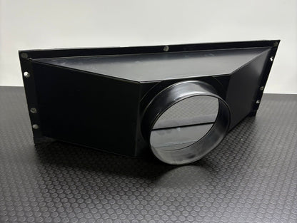 Black metal duct with circular opening on a textured surface