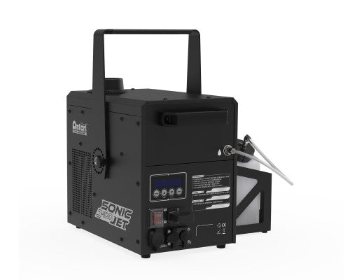 A black Antari J-100 Jet Fog Machine by Antari, featuring a control panel, switches, a top handle, and a visible fluid container on the side, designed for producing artificial snow effects similar to those of a stage fog machine.