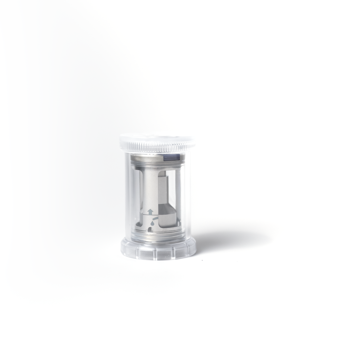 The PMI SmokeNINJA/GENIE Rep Shockproof Chamber (PMI_AC_CHAMB) is a compact stainless steel unit enclosed in a clear plastic container with a white lid, displayed against a plain white background.