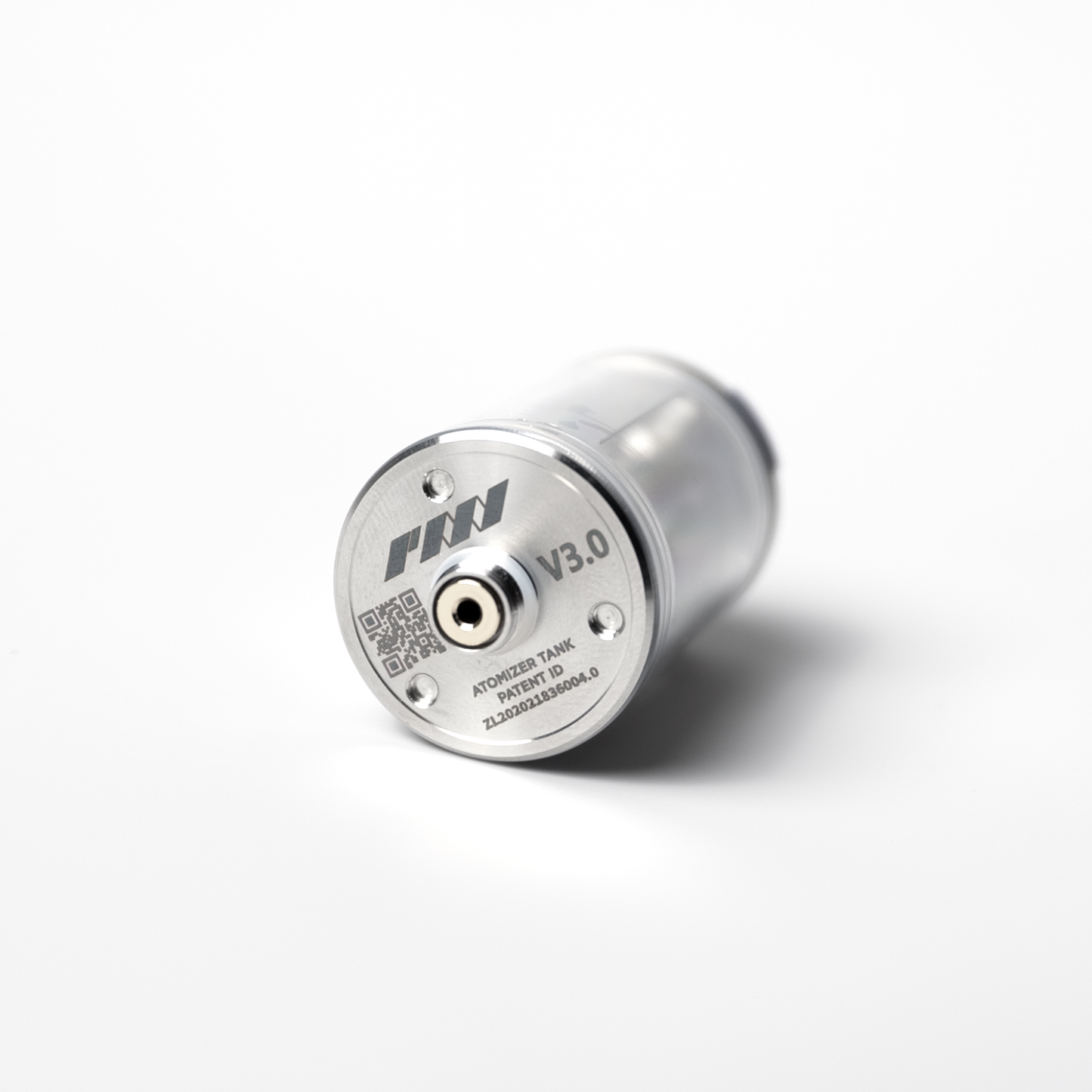 A close-up of the PMI SmokeNINJA/GENIE Rep Shockproof Chamber (PMI_AC_CHAMB), a cylindrical stainless steel vaping tank labeled “V3.0” with a central connector and engraved text, shown on a white surface.