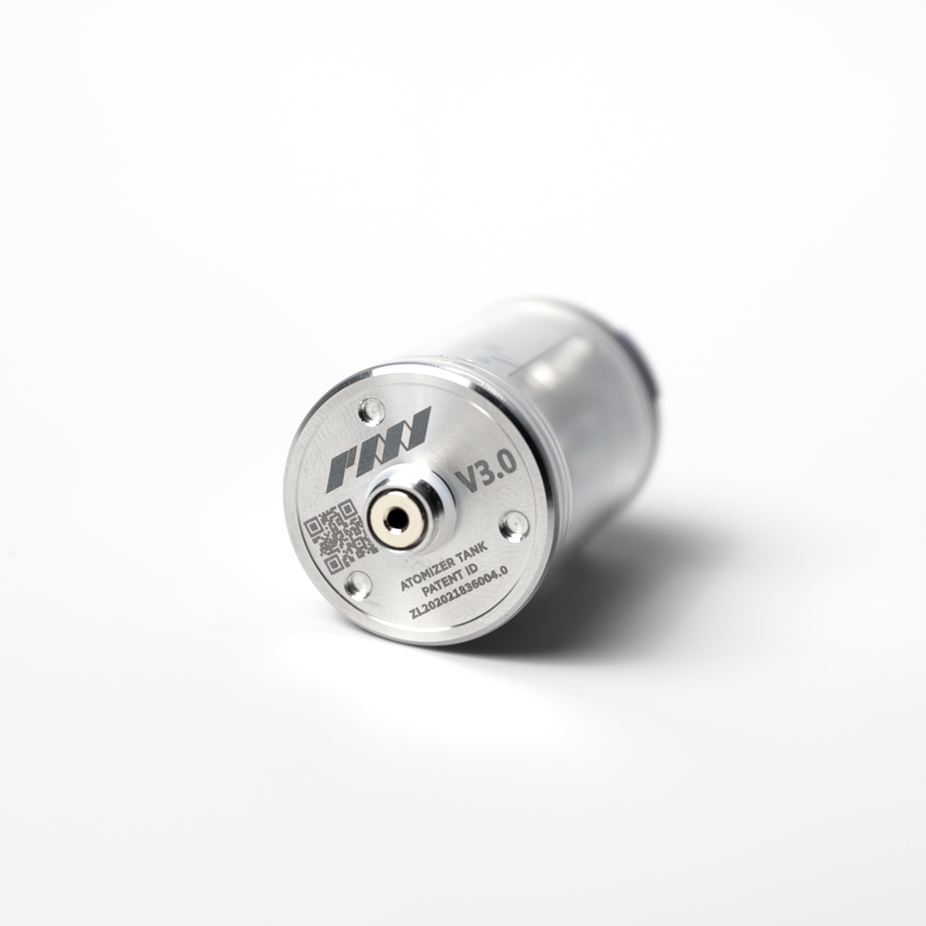 A close-up of the PMI SmokeNINJA/GENIE Rep Shockproof Chamber (PMI_AC_CHAMB), a cylindrical stainless steel vaping tank labeled “V3.0” with a central connector and engraved text, shown on a white surface.