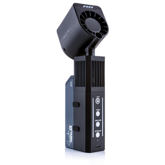 The PMI SmokeNINJA Pro Hazer Kit features a black handheld design with Fog, Dry Ice, and Steam buttons, a vented top, visible branding, and USB port. Ideal for photography and video production, it creates cinematic haze.