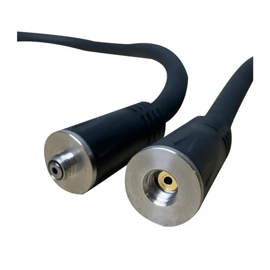 Close-up of two black PMI SmokeNINJA Extension Cable connectors with metal ends—one male, one female—for secure smoke delivery in fog chamber setups. The plain white background highlights the design.