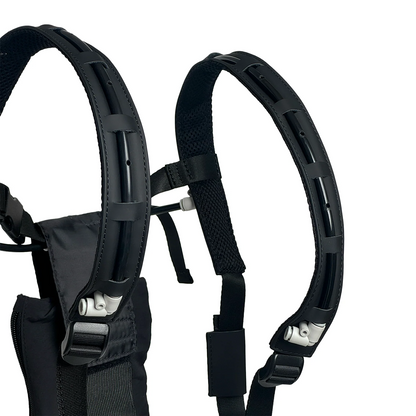 Close-up of two black padded, adjustable shoulder straps with ventilation holes and ergonomic design, like a pro harness, attached to the SmokeNINJA PRO/NINJA/GENIE PMI Smoke Vest by PMI.
