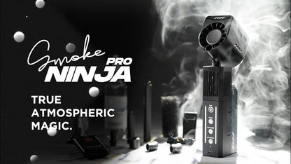The PMI SmokeNINJA Pro Hazer Kit (Haze, Smoke & Low Fog) emits dense cinematic haze with accessories, set against a dark backdrop and the tagline "True Atmospheric Magic"—ideal for photography and video production.